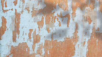 Old grunge and crack yellow wall and shadows. Background with copy space
