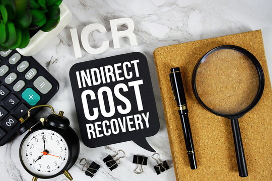 ICR - Indirect Cost Recovery acronym with calculator, alarm clock and magnifying glass, Business concept background