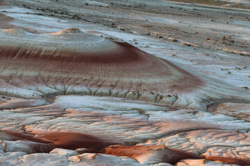 The colorful iron limestone formations of Kyzylkup at sunset, Kazakhstan