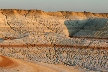 The colorful iron limestone formations of Kyzylkup at sunset, Kazakhstan
