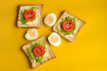 Breakfast consisting of toast with avocado and eggs. Healthy breakfast.
