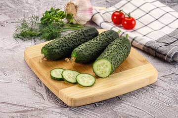 Raw green cucumbers with slices