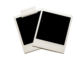 Two blank instant photo prints with tape on white background, ready for your memories