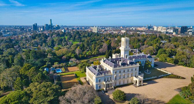 Historic Government House viewed from above with distant cityscape