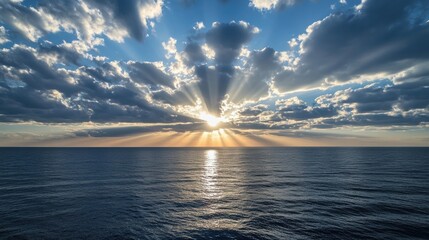 Majestic sunset over the serene ocean with dramatic clouds