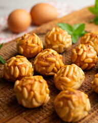 Panellets with pine nuts and almonds. A typical Catalan dessert made with marzipan and nuts.