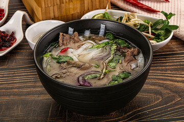 Vietnamese Pho Bo soup with beef and noodles
