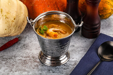 Pumpkin cream soup with prawns