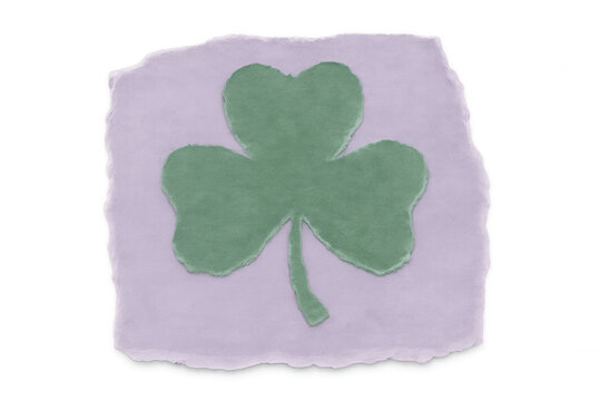 Green shamrock cut out of purple textured paper piece with transparent background, celebrating saint patrick's day