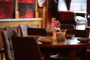 A decorative arrangement of flowers on a rustic wooden table, perfect for wedding, event or home decor