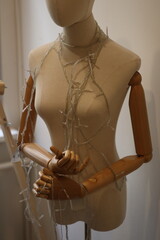 A mannequin wearing a chain around its neck, can be used for Halloween decorations or as a symbol...