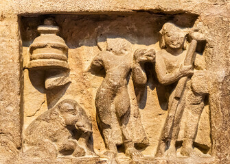 Fototapeta premium ruined stone relief illustrating buddhist teachings