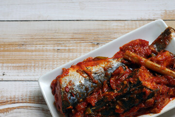 Sarden or Sardencis. Spicy Indonesian mackerel dish served in rich red chili sauce with lemongrass...