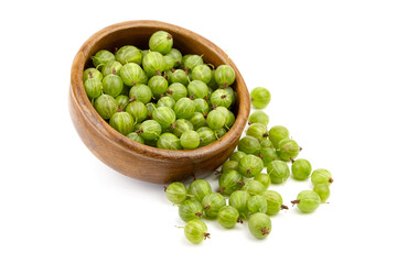 Fresh green gooseberries in a wooden bowl, surrounded by scattered berries, showcasing vibrant colors and natural textures, perfect for culinary and health-related concepts