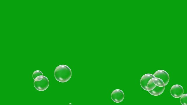 Floating soap bubbles on green screen background