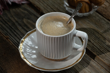 Cup of espresso coffee on wooden rustic table