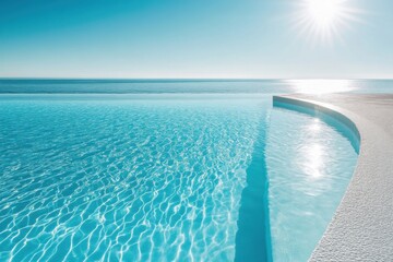 A tranquil infinity pool with brilliant turquoise water meets the endless blue horizon under a vibrant sun.