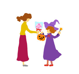 ハロウィンの魔女の仮装した女の子にお菓子をあげる女性