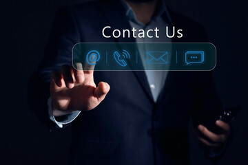 Contact us or Customer support hotline, Businessman touching on virtual screen contact icons (email, address, live chat, telephone). Customer service, helpdesk advice online support people connect.