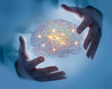 Human hands holding a glowing digital neural network brain - Artificial intelligence concept