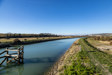 A footpath running alongside the River Ouse between Lewes and Southease, on a sunny spring day © lemanieh