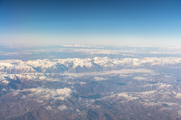 Obraz premium Plane Window View, Snow Mountains Aircraft Fly Landscape, Looking from Plane Cabin