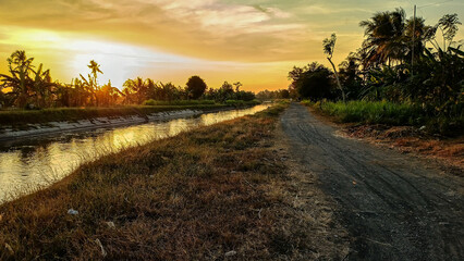A beautiful morning view. The sun was just rising, its orange hues. The sky was a beautiful blend of blue and orange.