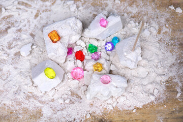 Artificial gemstones in broken gypsum blocks