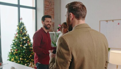 Fototapeta premium Coworkers working in office with christmas tree in background