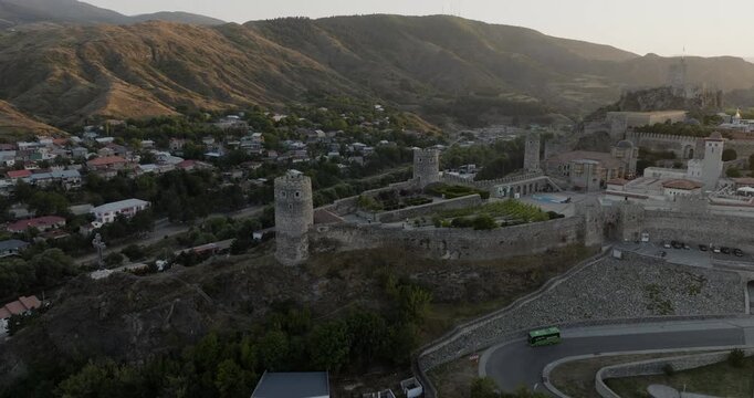 Aerial view of the Rabati Castle, its stone walls and towers contrasting with the lush greenery and mountains, Akhaltsikhe, Samtskhe-Javakheti, Georgia.