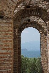 Fototapeta premium A View of Lake Garda Through the Grottoes of Catullus