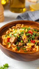 Hearty bowl of noodle soup with meat