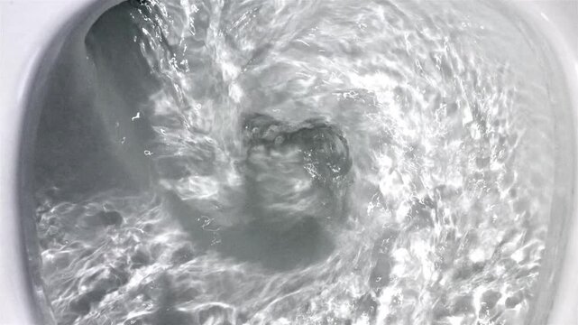 The flushing process in the toilet bowl, top view