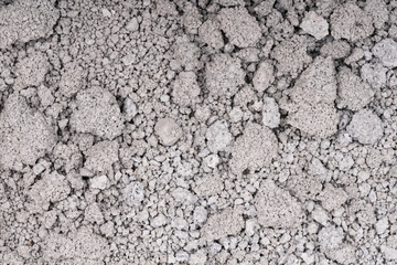 Texture of cracked concrete wall close-up. Damaged stone wall. Destroyed cement. crumbling stone