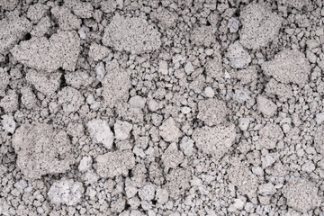 Texture of cracked concrete wall close-up. Damaged stone wall. Destroyed cement. crumbling stone