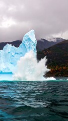 Iceberg breaking off in a dramatic display