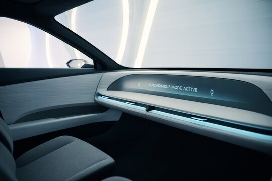 Futuristic autonomous car interior with sleek dashboard and glowing interface screen showing "Autonomous Mode Active" on light background. Ai generative