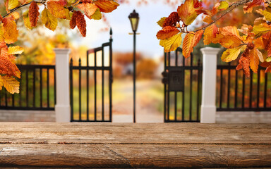 Autumn country scene with autumn decor, leaf, branch, gate, wreath styled setting for home, outdoor, cottage, lifestyle, estate, porch or countryside real estate backdrops