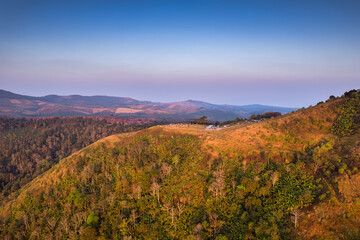 Aerial view of golden hill mountain with tourist traveling among tropical forest in the morning at Phu Lom Lo, Loei