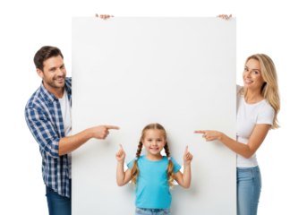 Caucasian family (father in plaid shirt, mother in white top, daughter in blue t-shirt) peeking behind a blank white sign, pointing at its center in a bright studio, concept for communication