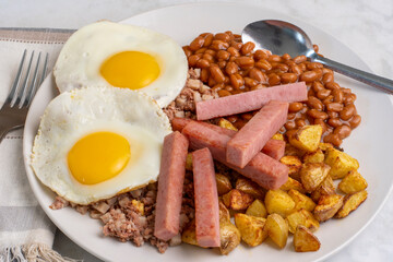 fried eggs with corn beef hash,  baked beans and spam fries