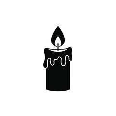 Black candle with dripping wax and flame burning