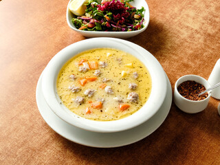 Meatball soup with carrot named eksili terbiyeli sulu köfte or eksili köfte