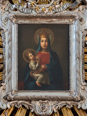 VIENNA, AUSTIRA - JULI 5, 2021: The painting of Beastfeeding Madonna in the church Kapuzinekirche by unknown baroque artist .