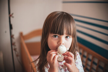 A portrait of a sad girl holding her teddy bear
