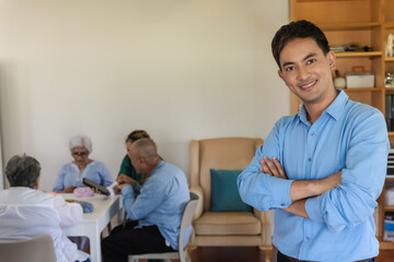 Obraz premium Smiling Asian man feeling happy to visit grandparents in senior home care