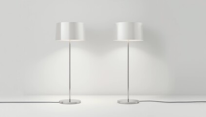 Two modern floor lamps with sleek metallic bases and cylindrical shades 