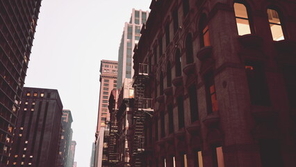Tall buildings loom against a pastel sky, showcasing a blend of modern glass and classic stone. Construction scaffolding suggests ongoing development. Day transitions into evening.