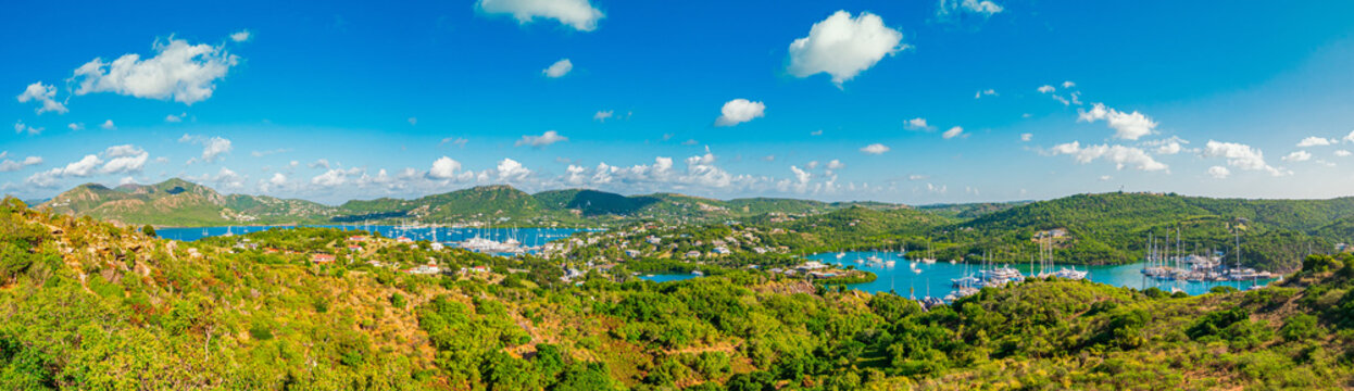 Generated ImagePanoramic shot of harbours and marinas in Antigua and Barbuda, with Falmouth on the left and Nelson's Dockyard on the right, with superyachts at dock in sunny day