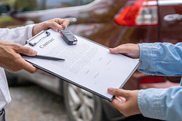 lease, rental car, sell, buy. Dealership manager send car keys to the new owner.  Sales, loan...